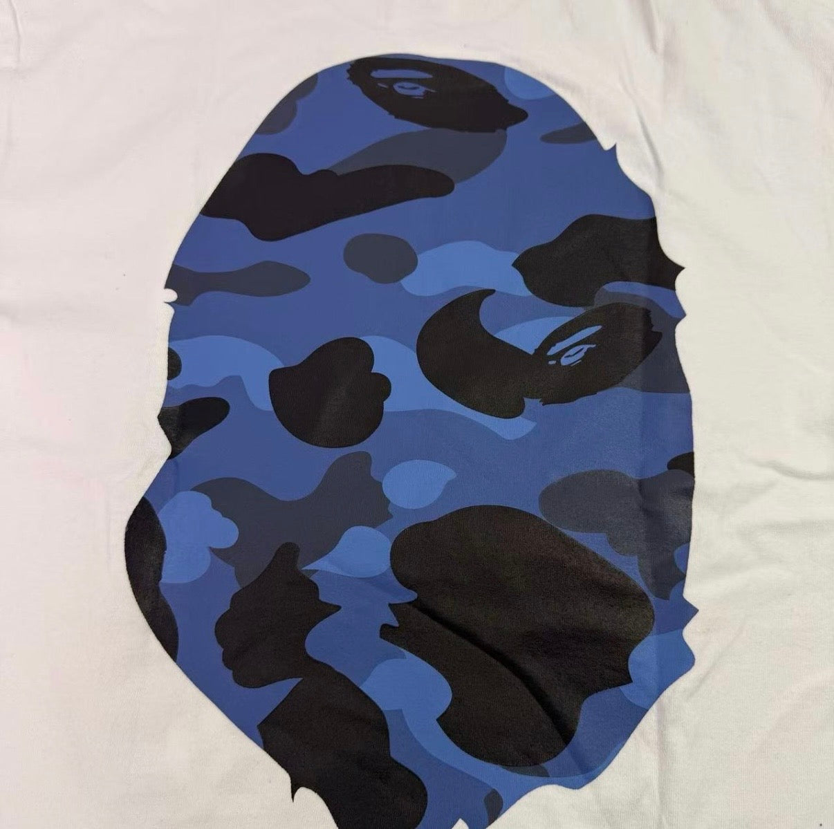 Blue and black camouflage pattern on a white background